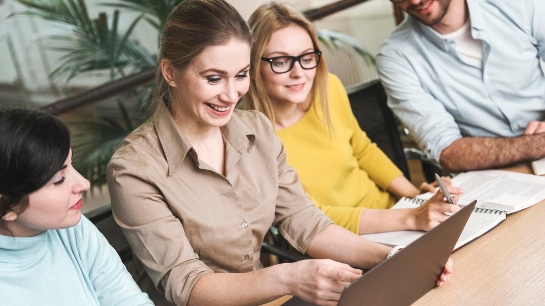 Business owner reviewing quarterly financial reports with accountant